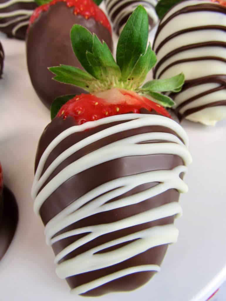 chocolate covered strawberry with white chocolate drizzle