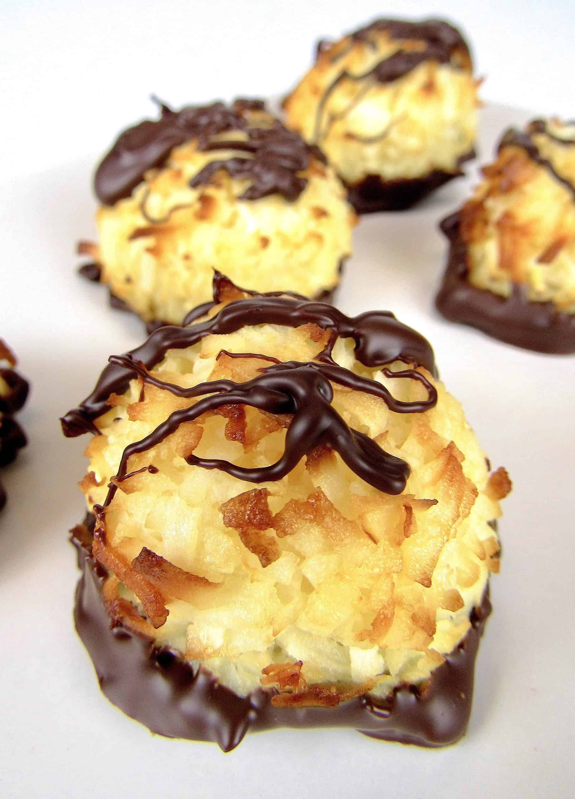 coconut macaroons with chocolate drizzled on top