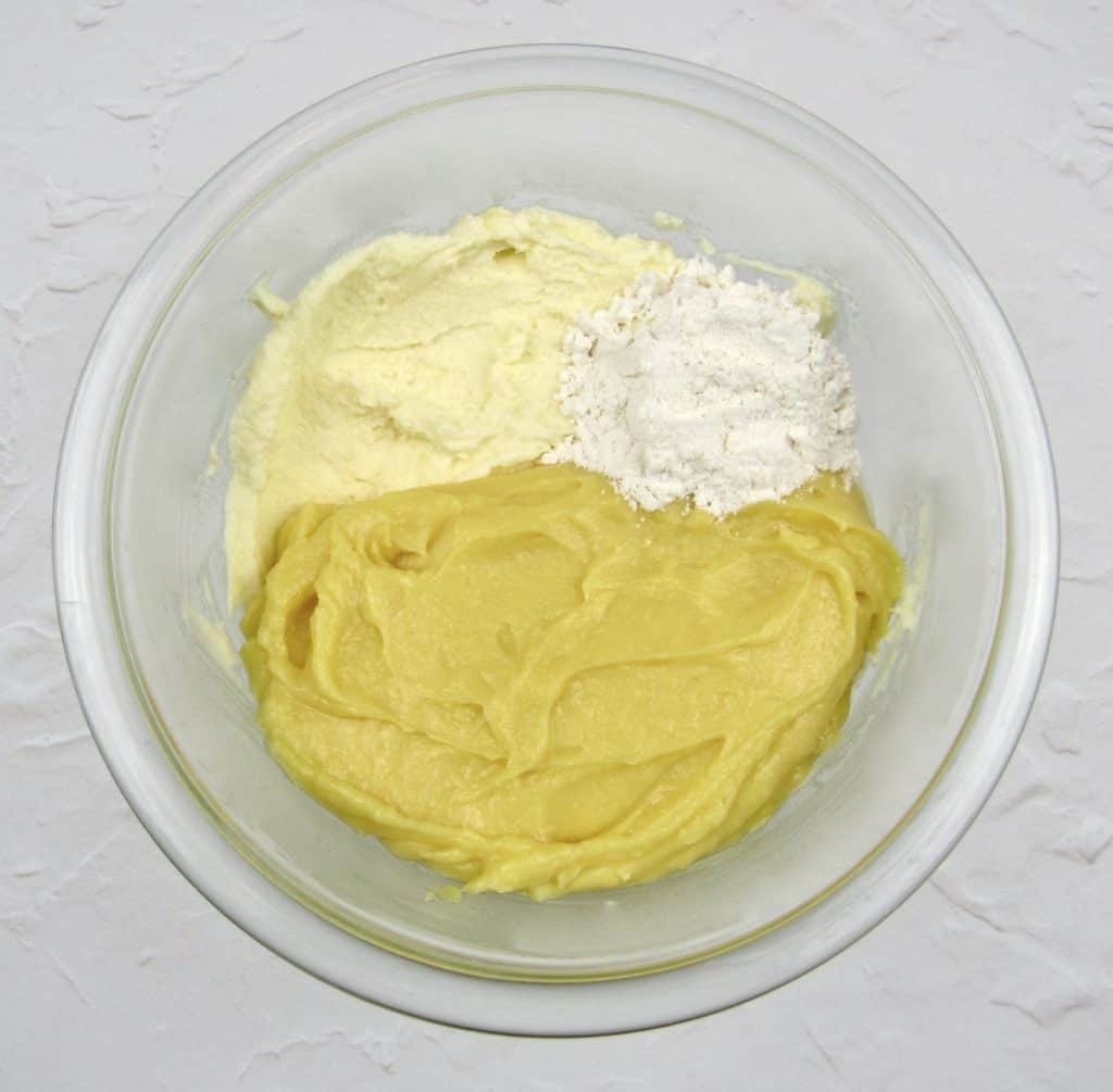 lemon frosting ingredients in glass bowl