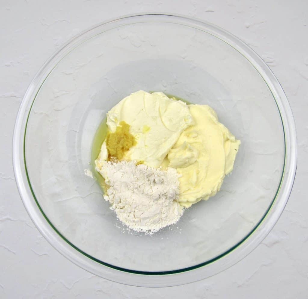 lemon frosting ingredients in glass bowl