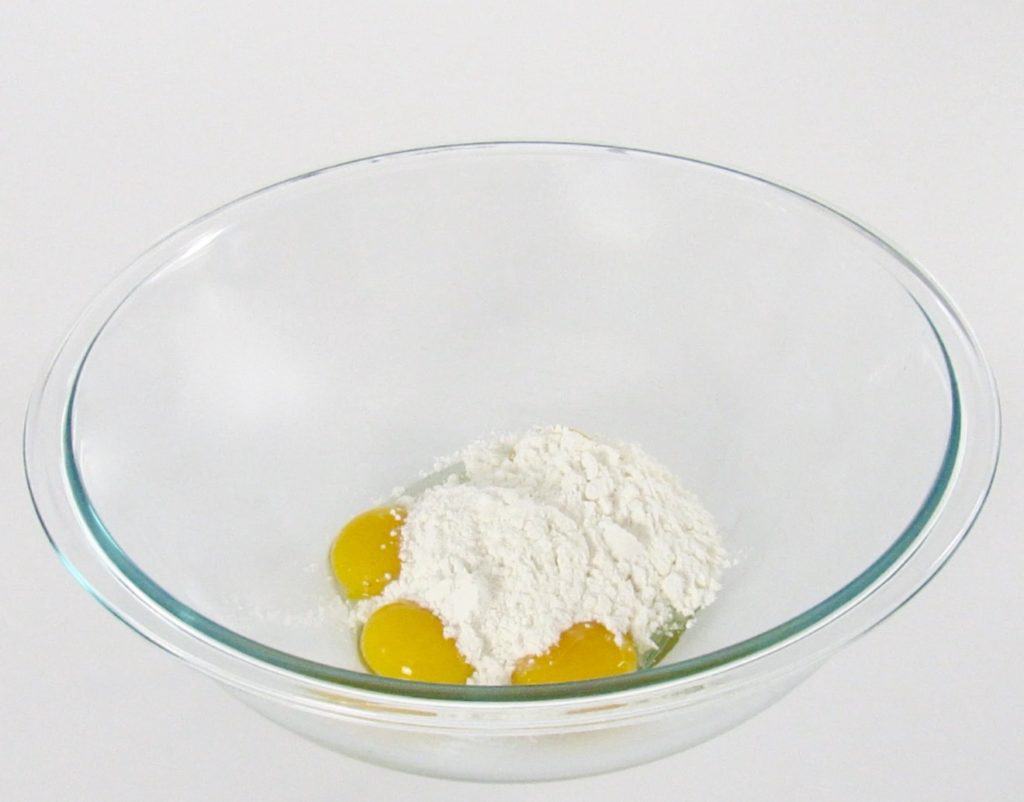 eggs and sweetener in glass bowl