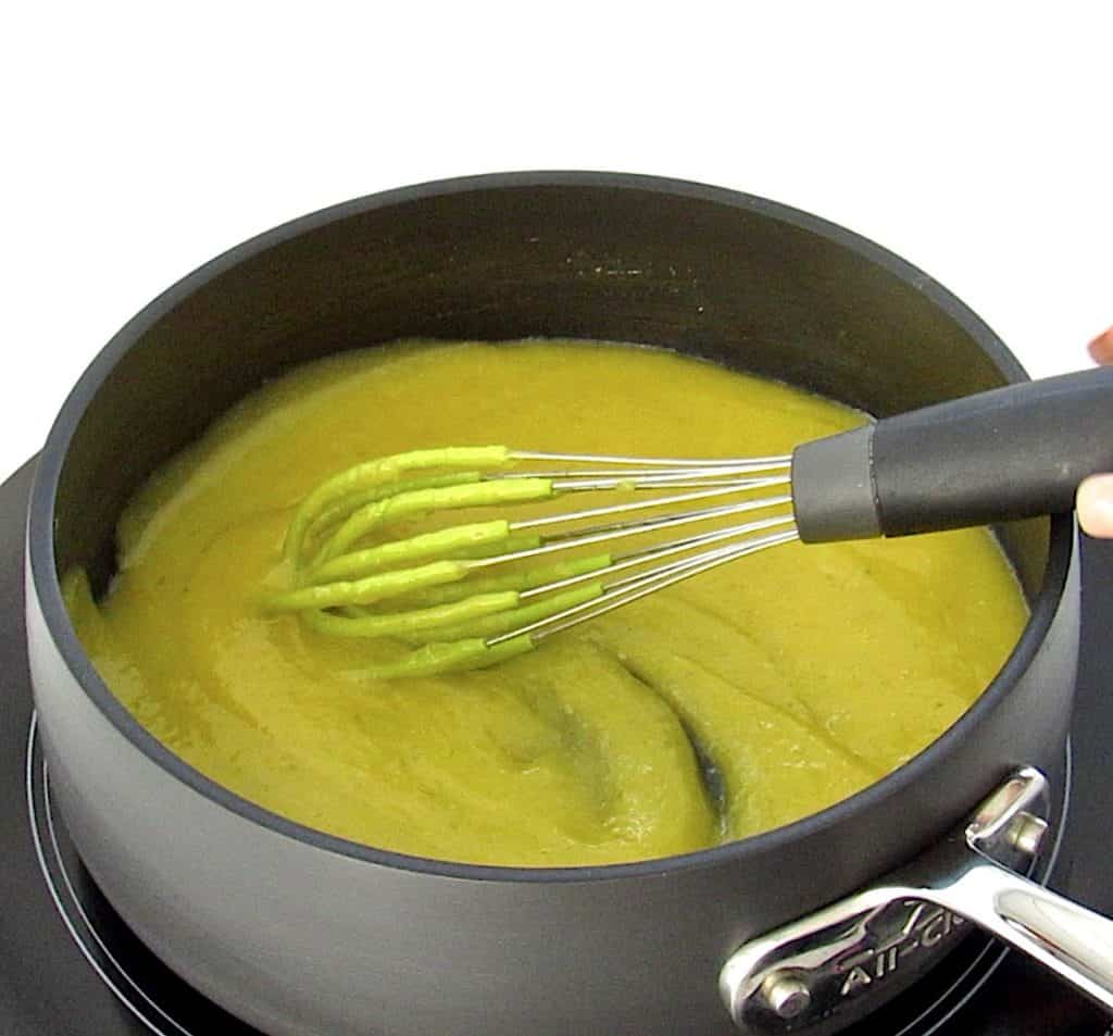 key lime curd in saucepan with whisk