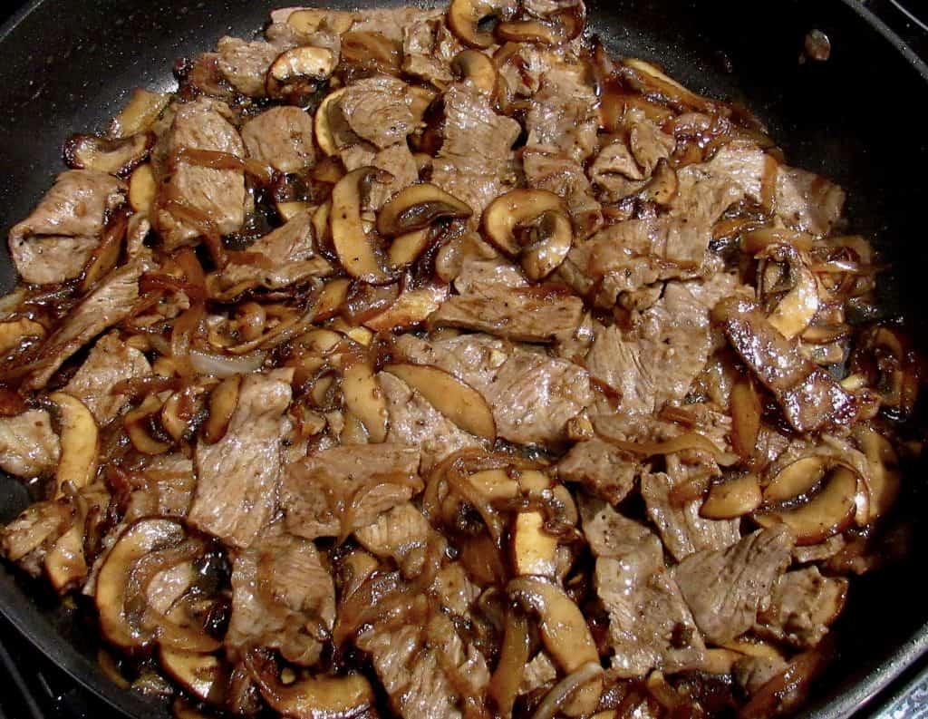 steak mushrooms and onions in skillet