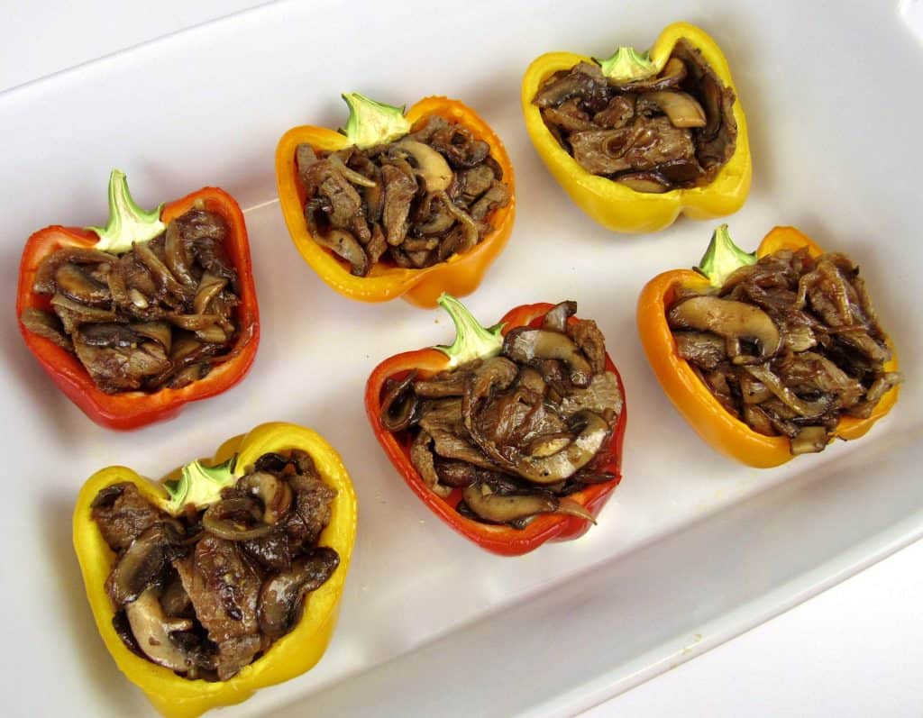 steak mushrooms and onions stuffed in halved peppers