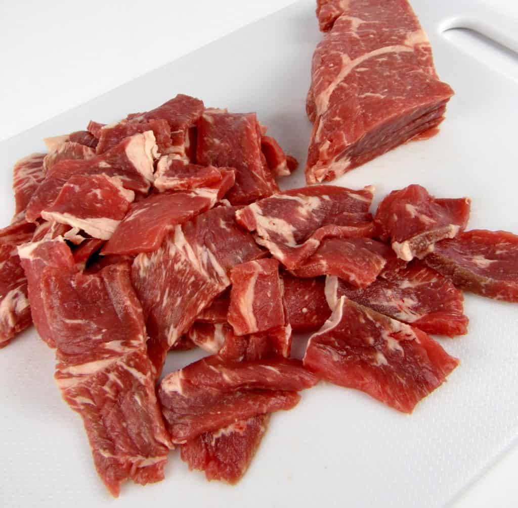 steak cut thin on cutting board