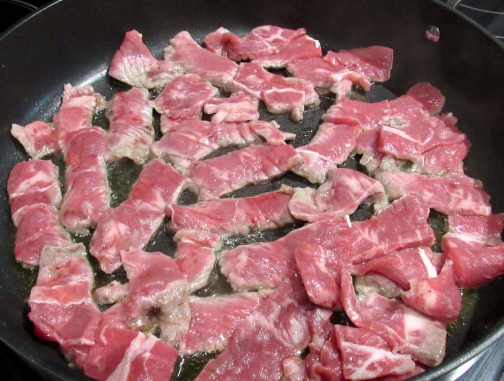 slices of steak in skillet