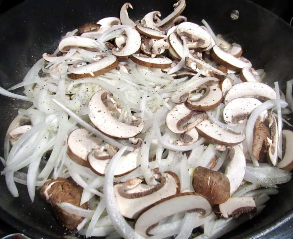 onions and mushrooms in skillet