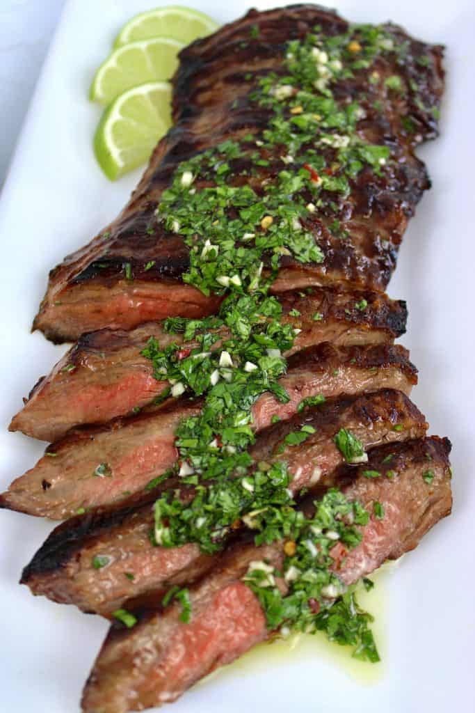 grilled skirt steak sliced with chimichurri sauce on top