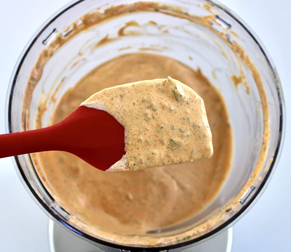 Keto Chipotle Ranch Dressing on spatula over food processor
