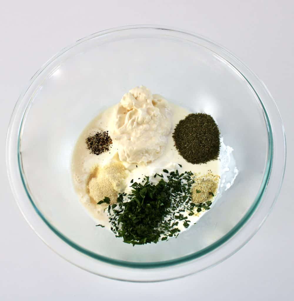 ingredients for ranch dressing in glass bowl unmixed