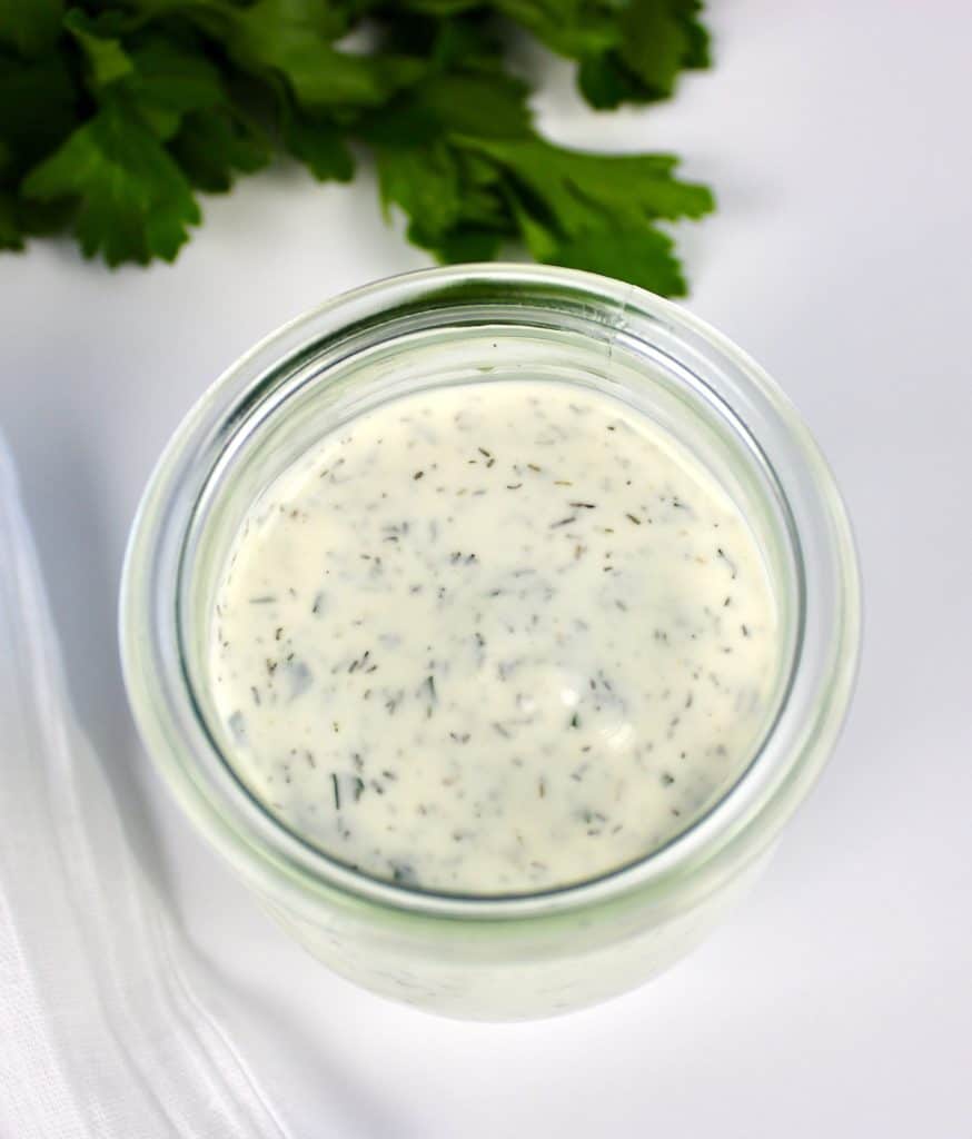 overhead view of keto ranch dressing in glass jar