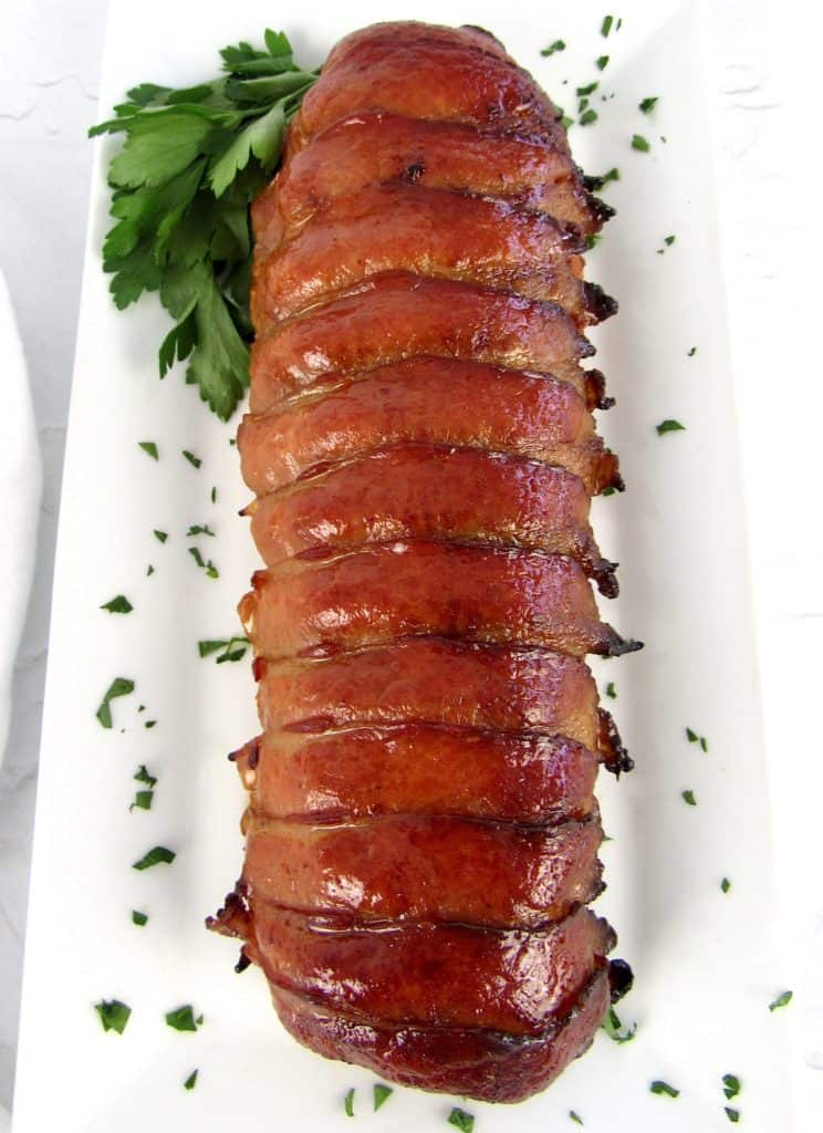 Bacon Wrapped Pork Tenderloin on white plate