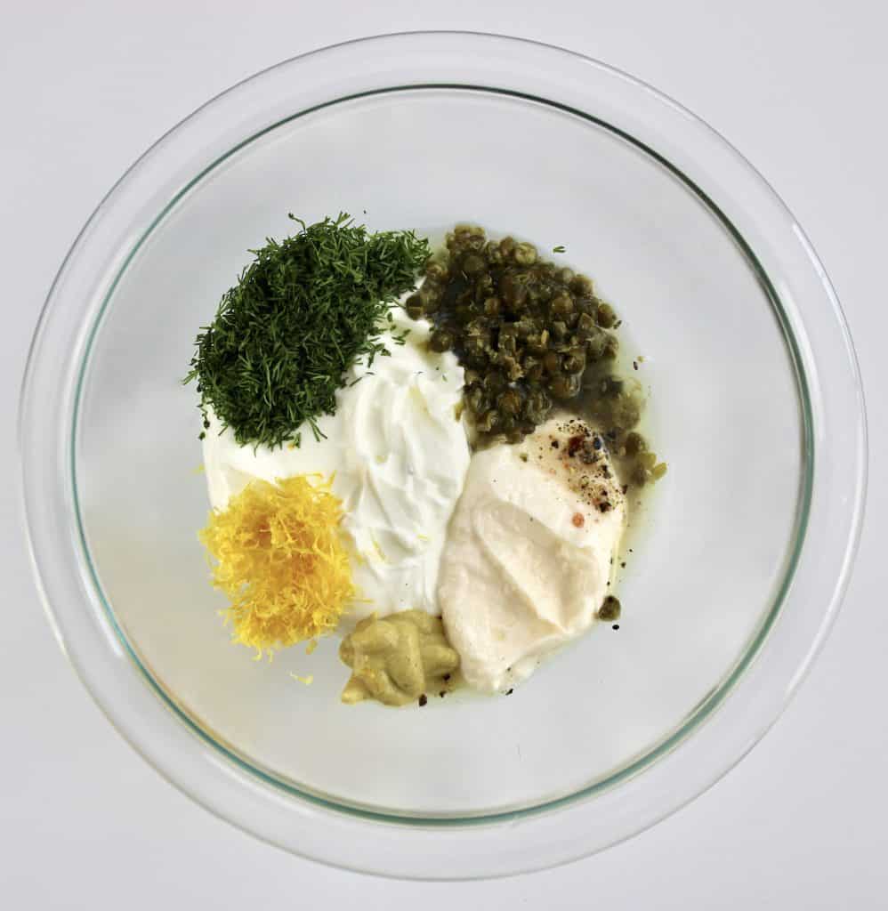 creamy dill sauce ingredients in glass bowl unmixed