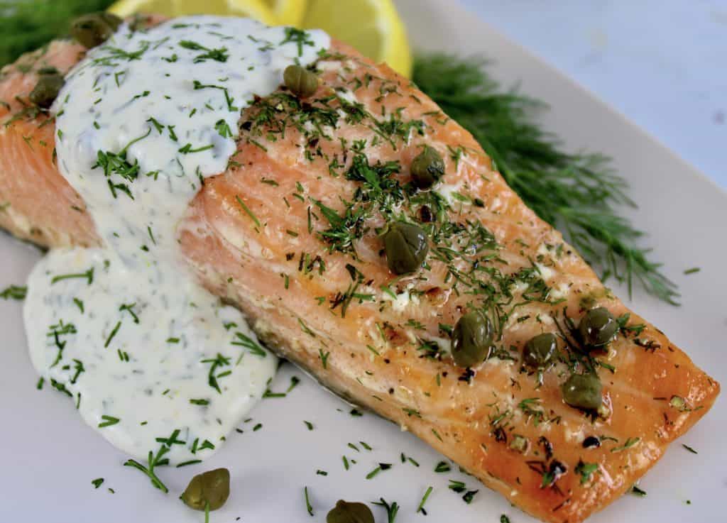 closeup of Baked Salmon with Creamy Dill Sauce on plate