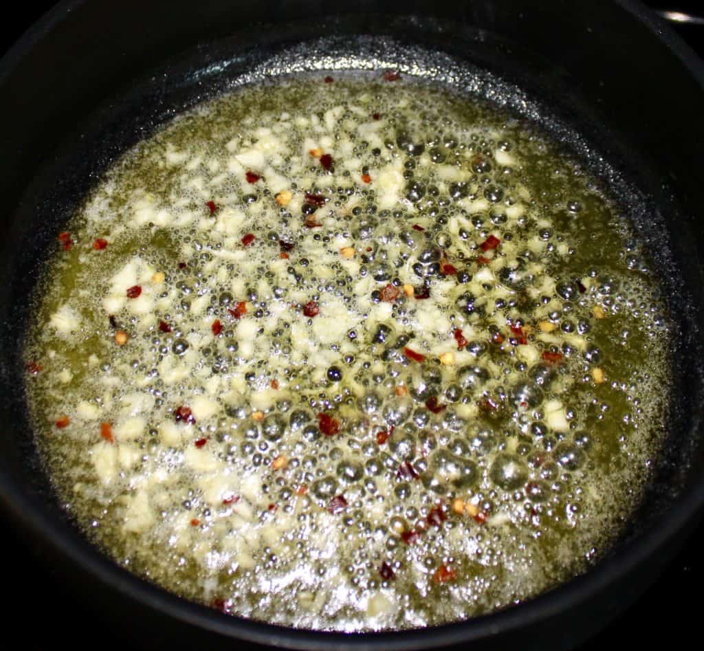 melted butter garlic and red pepper flakes in saucepan
