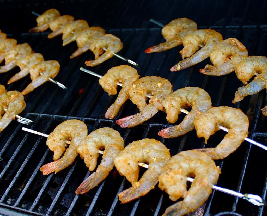 raw cajun shrimp skewers on grill