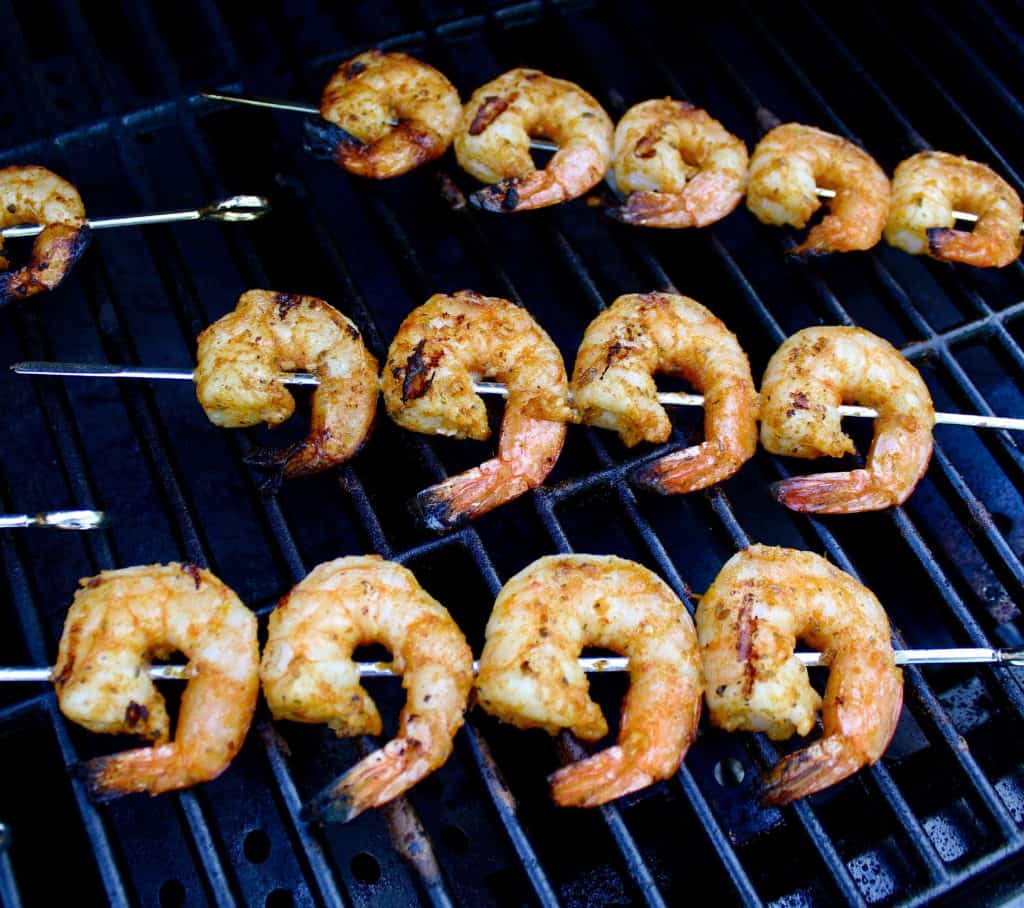 cooked cajun shrimp skewers on grill