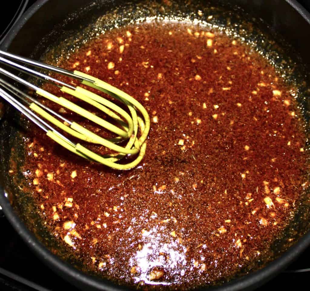 cajun garlic butter sauce with whish in saucepan