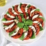 Caprese Salad with Balsamic Reduction on white plate