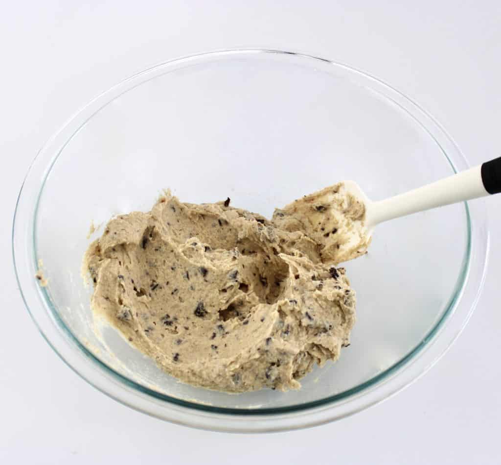 cookie dough fat bombs batter in glass bowl with spoon