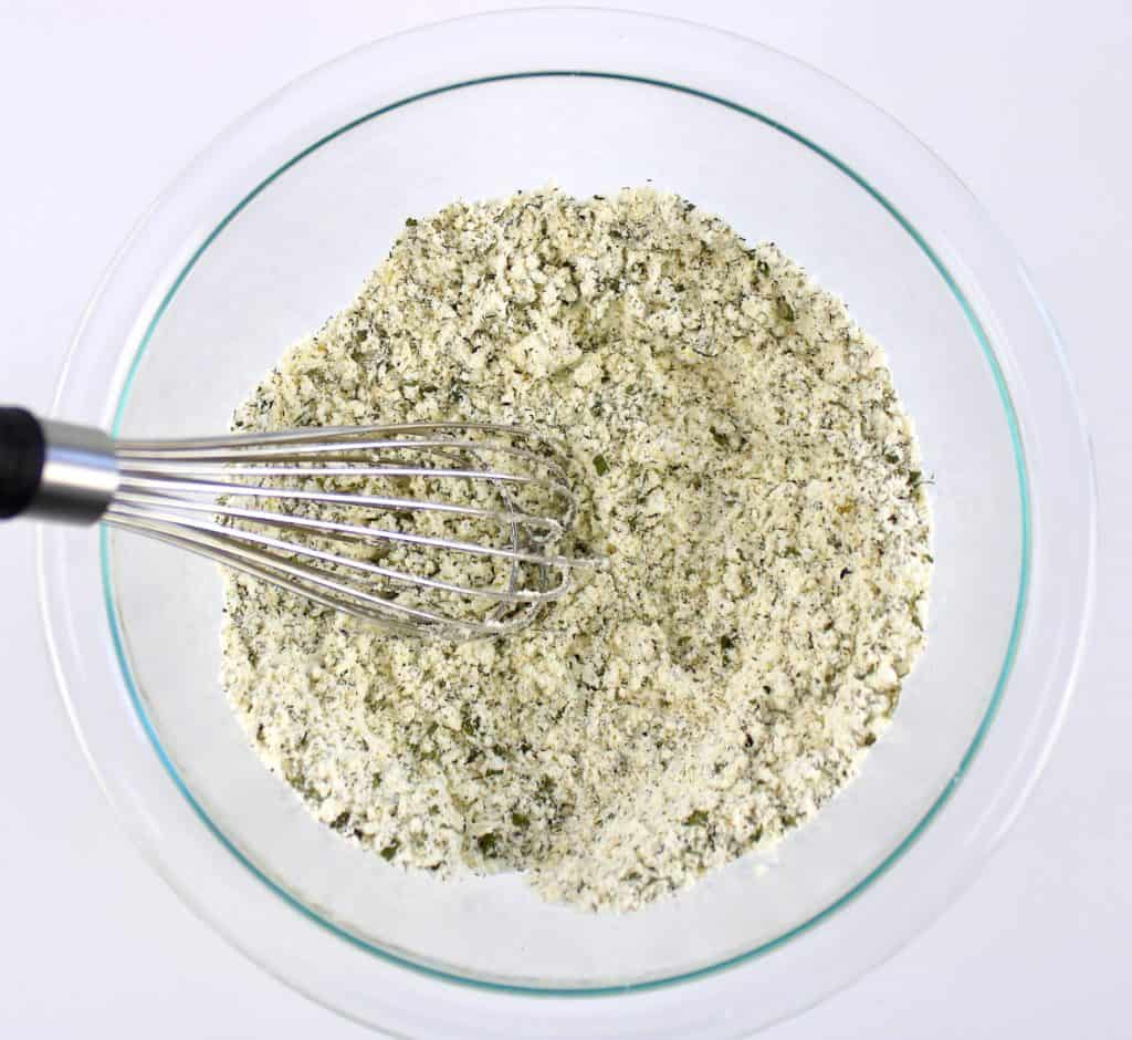 Homemade Ranch Seasoning Mix ingredients whisked in glass bowl