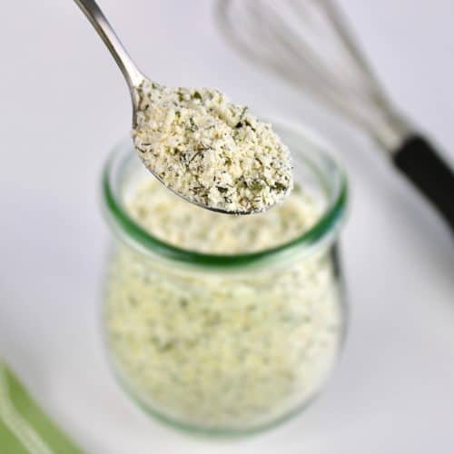 ranch seasoning mix being spooned out of jar