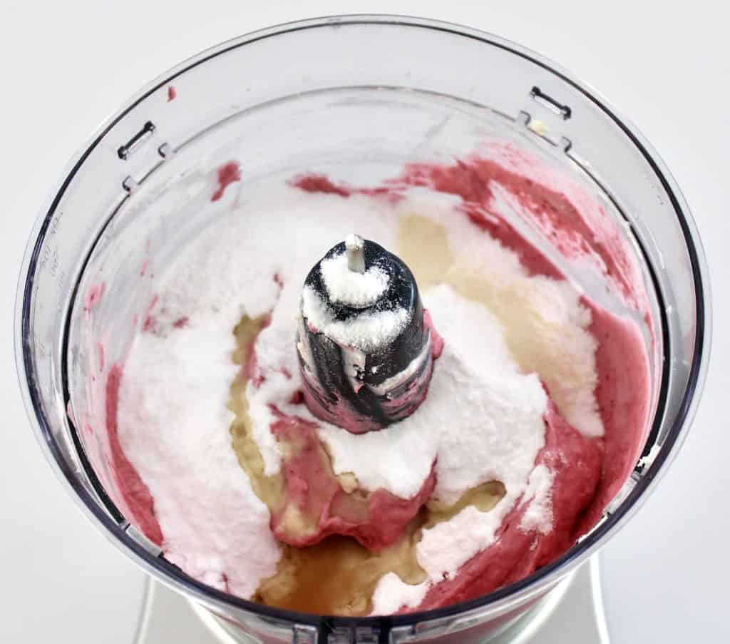 raspberry ice cream ingredients in food processor bowl