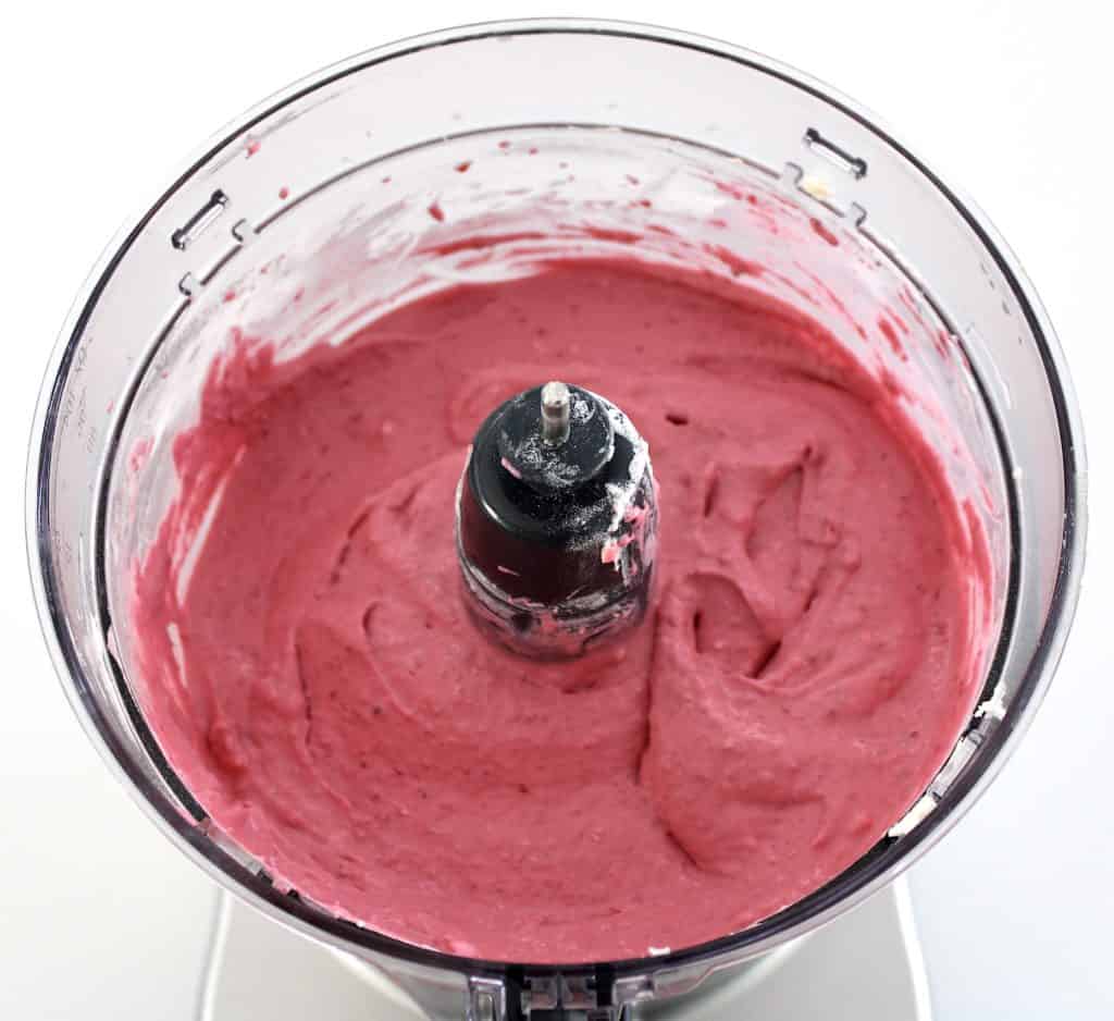 raspberry ice cream blended in food processor bowl