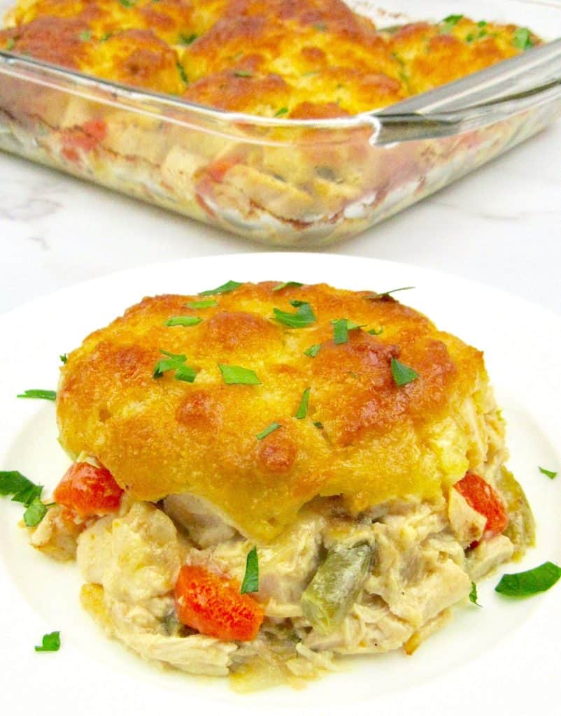 piece of chicken pot pie casserole on white plate with casserole in the background