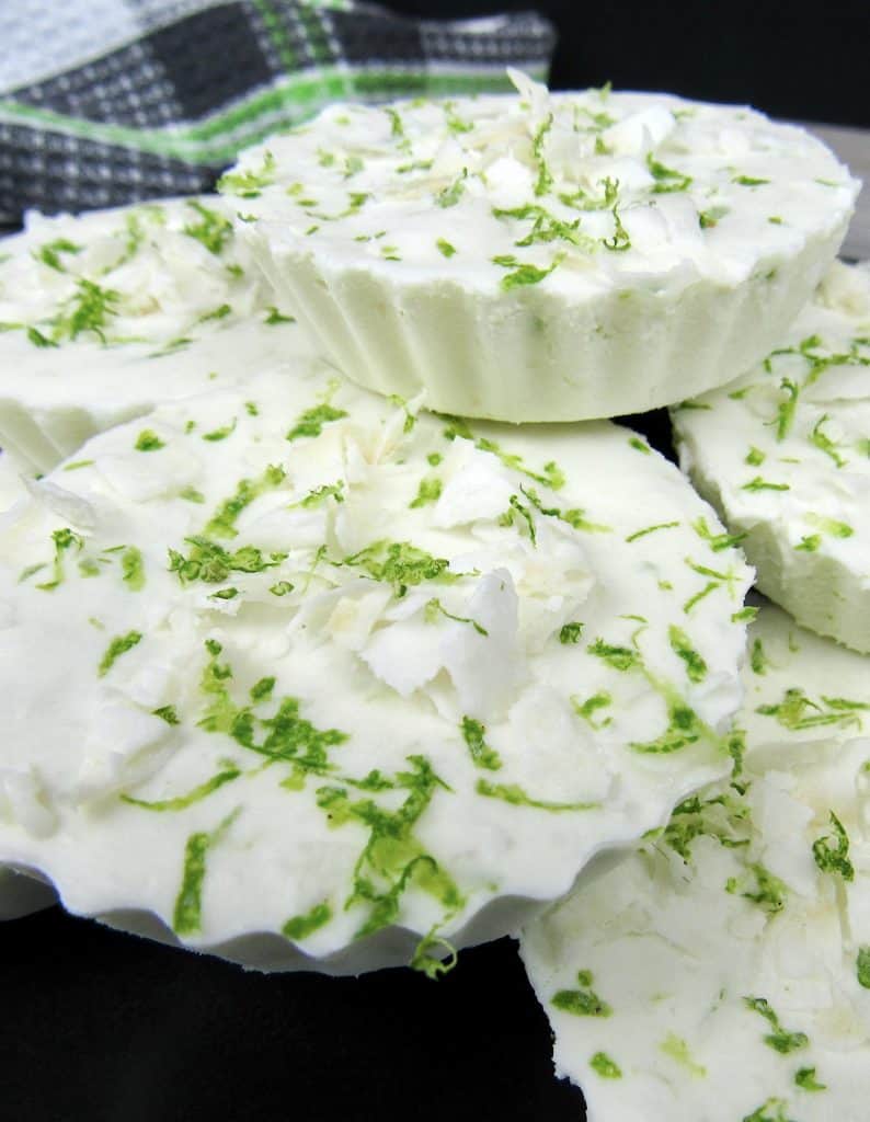 Coconut Lime Fat Bombs stacked up on black plate