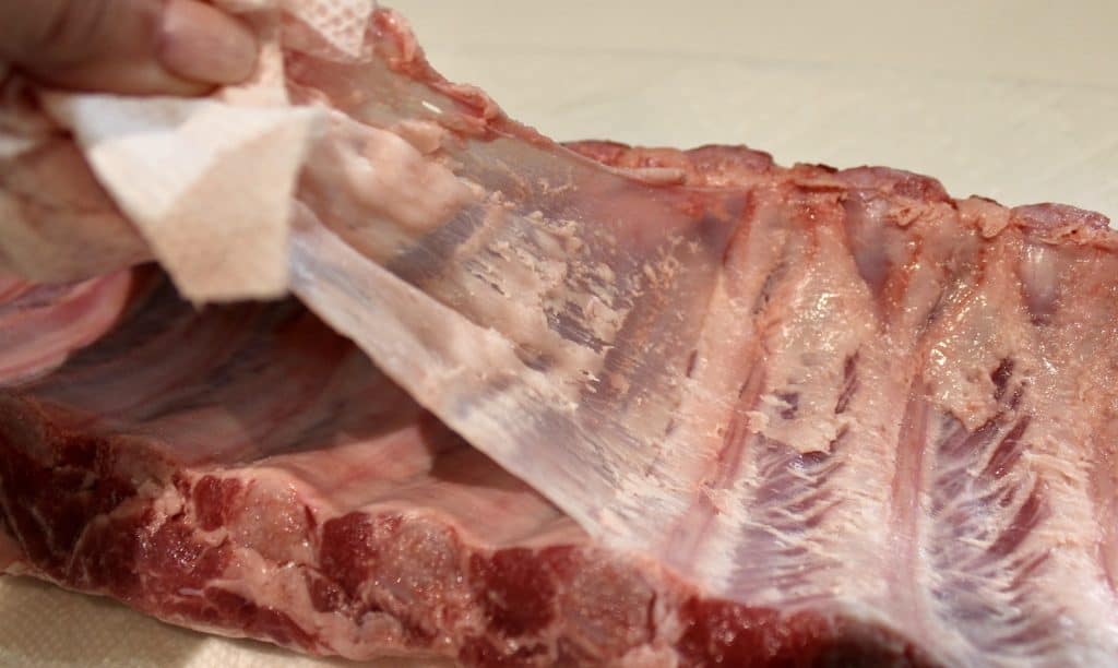 raw rack of ribs pulling membrane off