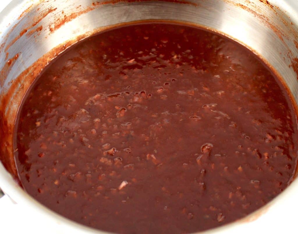 Keto Raspberry Chipotle BBQ Sauce cooking in saucepan
