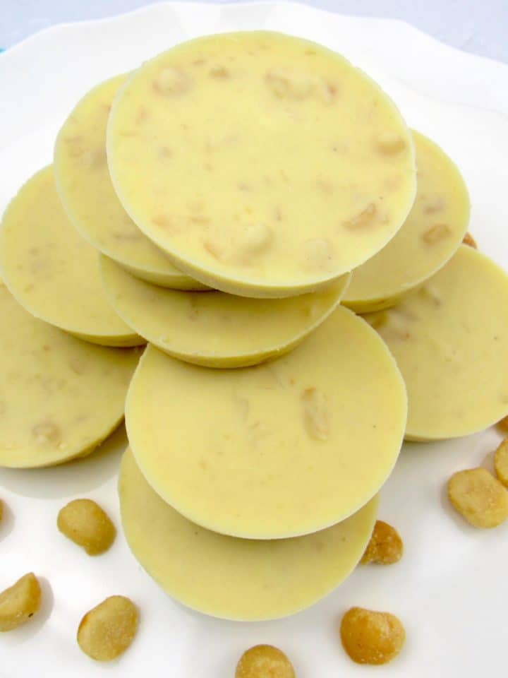 stacked white chocolate macadamia nuts on white plate