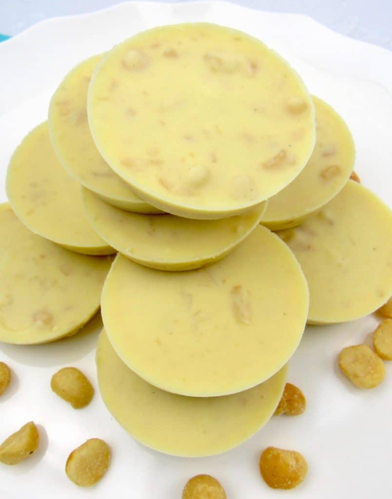stacked white chocolate macadamia nuts on white plate