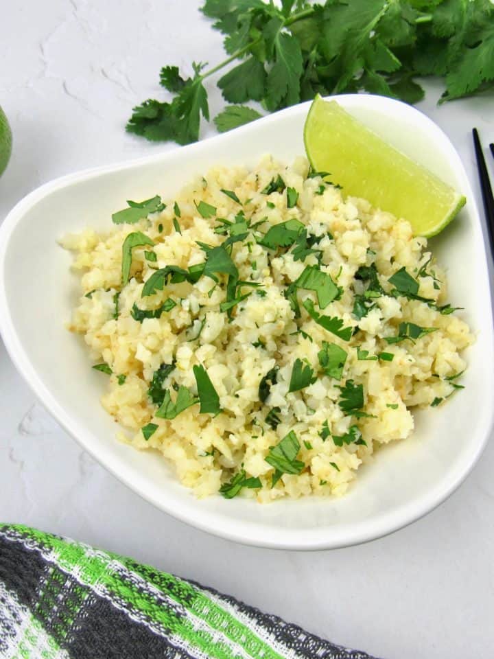 lime cilantro cauliflower rice in white bowl
