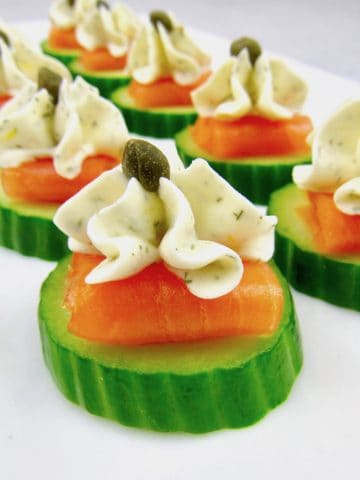 closeup of Smoked Salmon Cucumber Bites on white platter