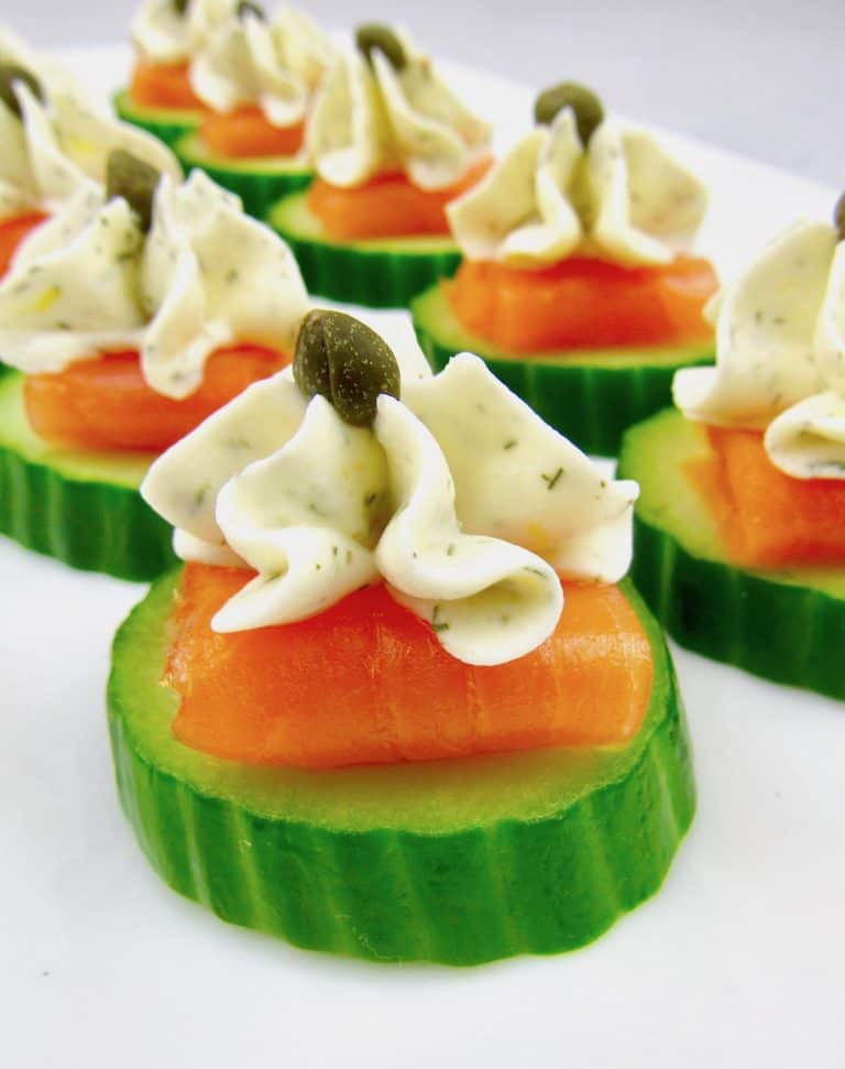 closeup of Smoked Salmon Cucumber Bites on white platter