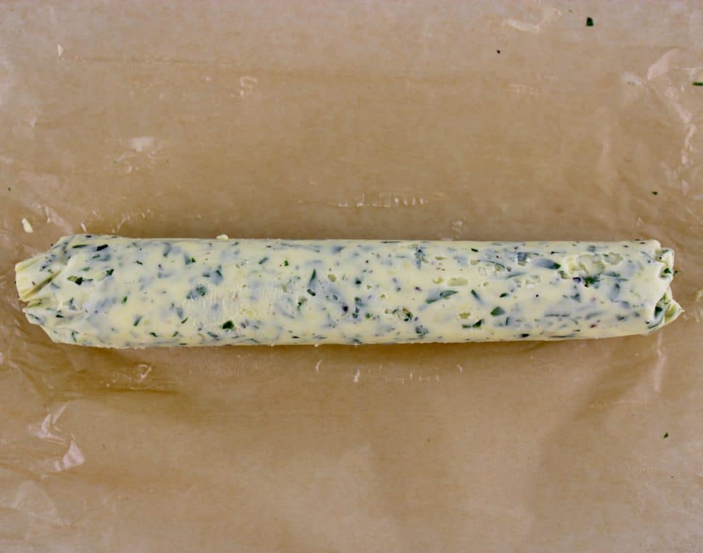 compound butter log on parchment paper