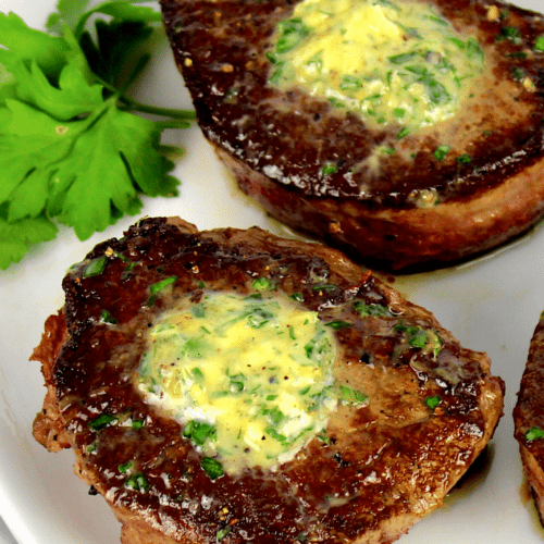 closeup of Pan-Seared Filet Mignon Pin with compound butter on top