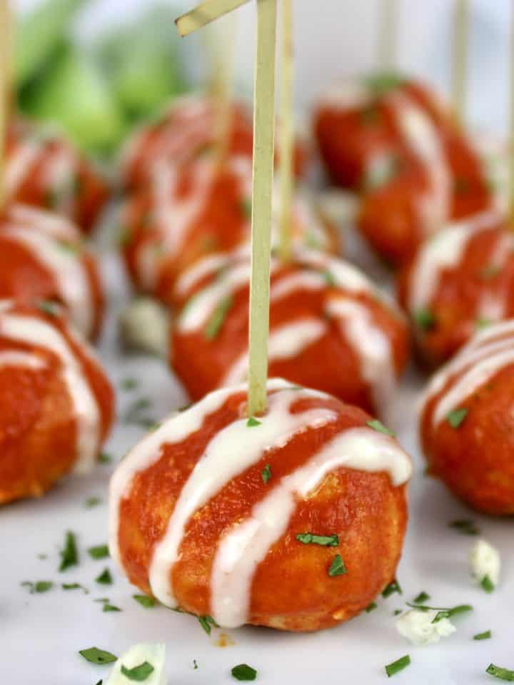 Keto Buffalo Chicken Meatballs with toothpicks on white plate