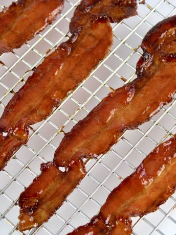 closeup of candied bacon on rack