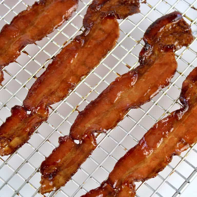 closeup of candied bacon on rack