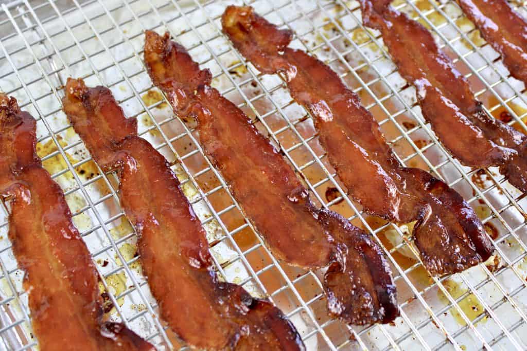 cookied candied bacon on baking rack