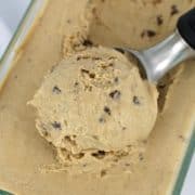 closeup of scoop of coffee chip ice cream in glass container