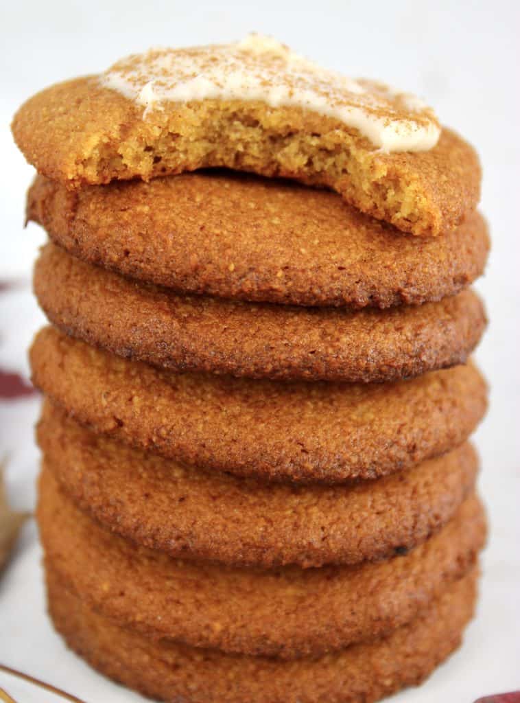 pumpkin cookies stacked with bite taken out