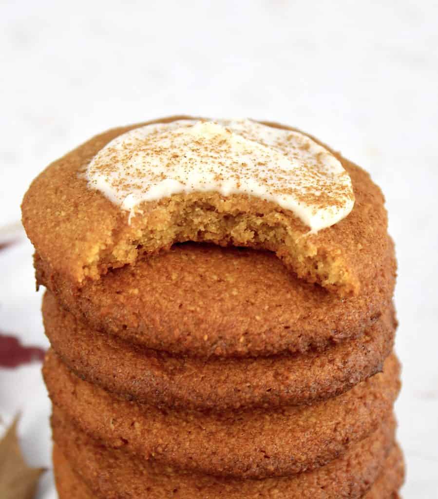 closeup of pumpkin cookies stacked with bite taken out