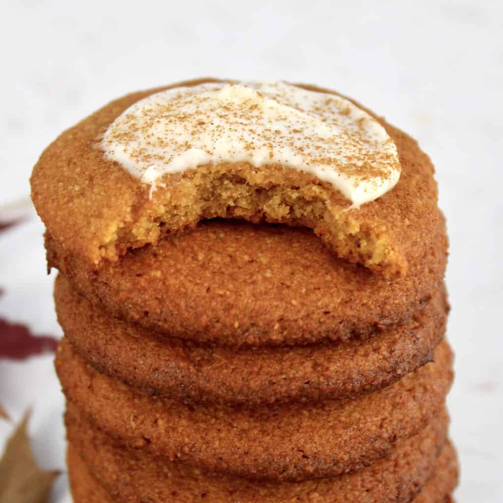 closeup of pumpkin cookies stacked with bite taken out