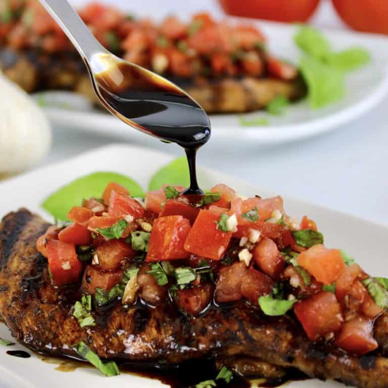 balsamic reduction spooned over chicken bruschetta