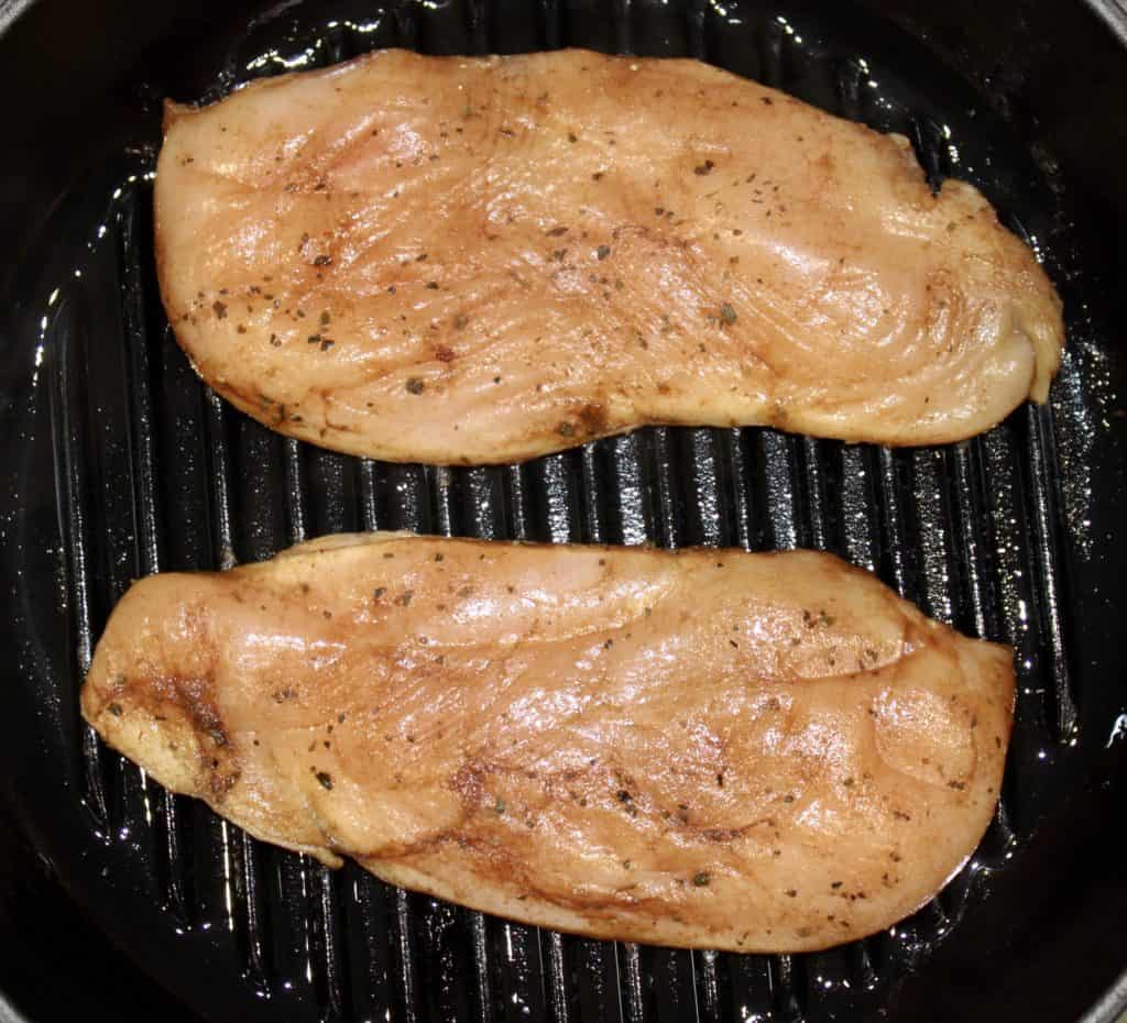 raw chicken on grill pan