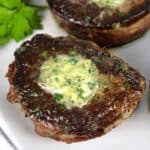 closeup of Pan-Seared Filet Mignon Pin with compound butter on top